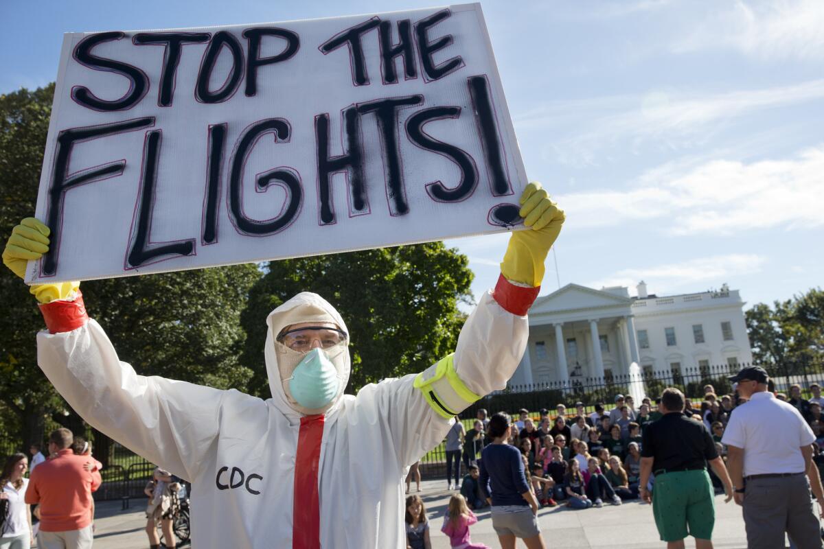 Jeff Hulbert, of Annapolis, Md., protests U.S. handling of Ebola cases outside of the White House.