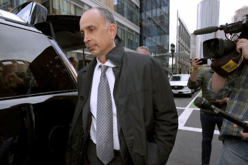 California businessman Stephen Semprevivo departs federal court Tuesday, May 7, 2019, in Boston, after pleading guilty to charges that he bribed the Georgetown tennis coach to get his son admitted to the school. (AP Photo/Steven Senne)
