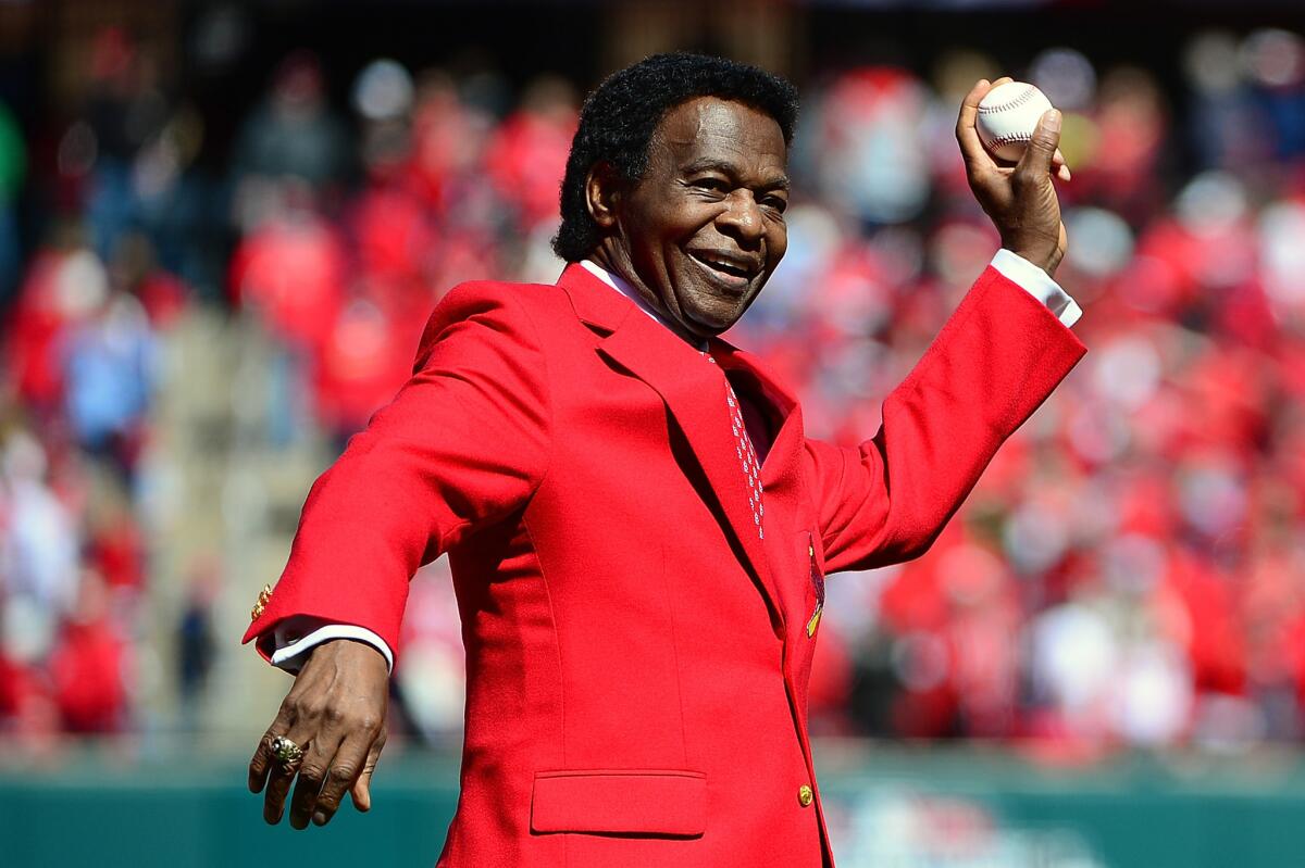 Hall of Famer Lou Brock throws out the ceremonial first pitch before the Cardinals home opener against the Milwaukee Brewers.