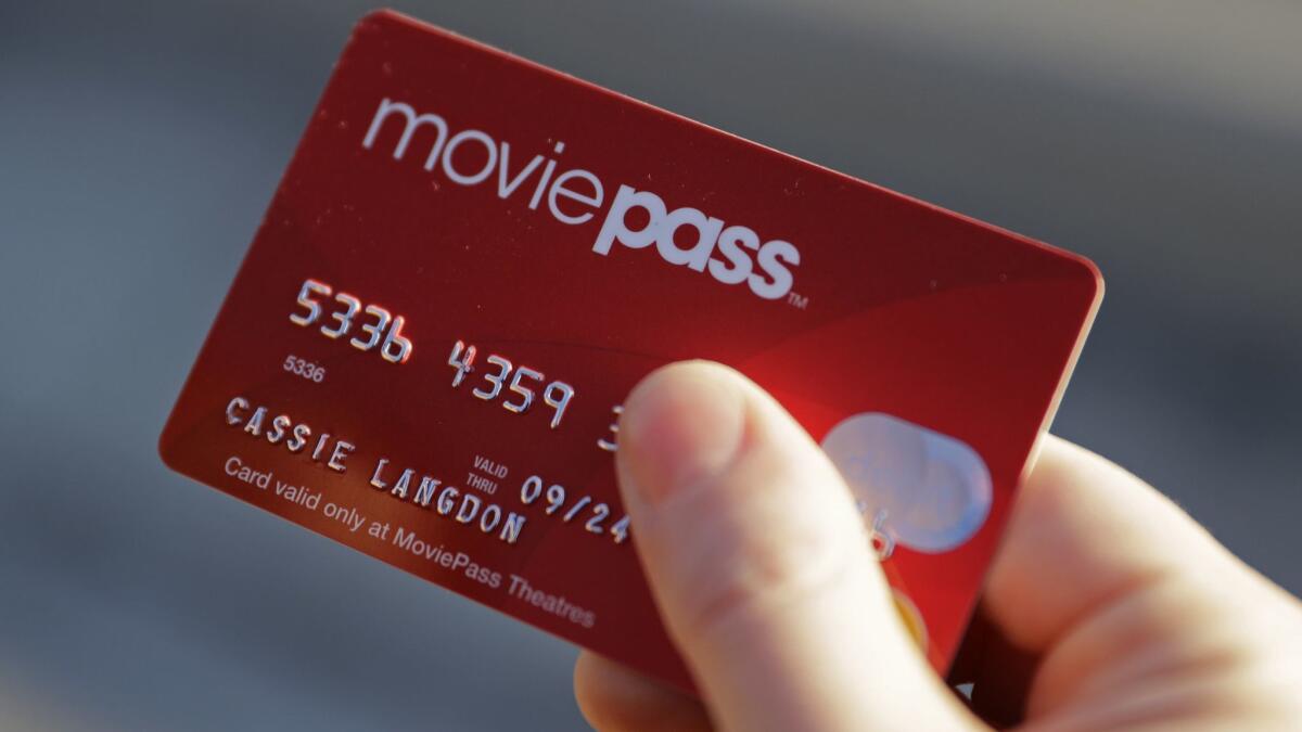 A MoviePass card, held outside an AMC theater.