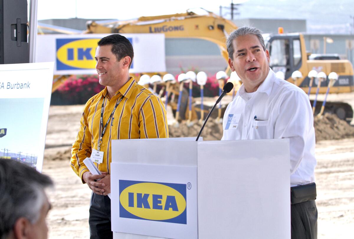 Mayor Bob Frutos speaks to the crowd gathered as IKEA public affairs manager Joseph Roth stands nearby at a groundbreaking ceremony for the Swedish retailer's new location in Burbank on Tuesday, Sept. 1, 2015.