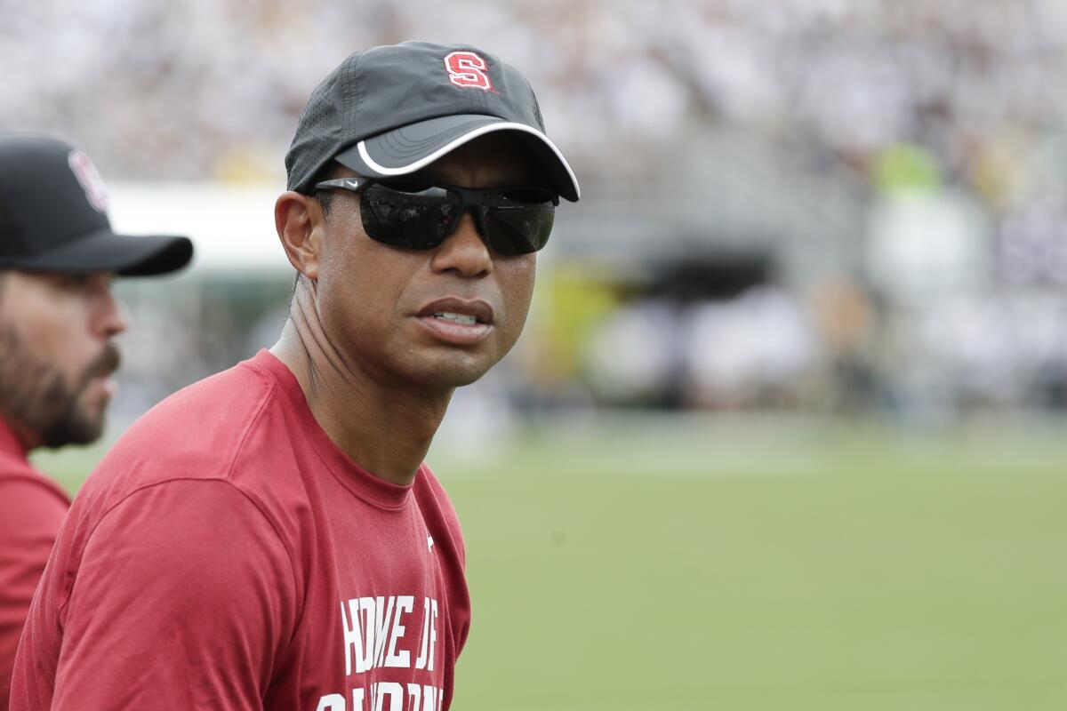Stanford alum Tiger Woods watches the Cardinal's 45-27 loss to Central Florida in Orlando on Sept. 14, 2019.