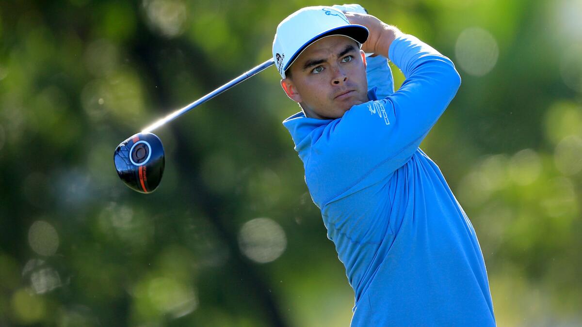 Rickie Fowler watches his tee shot at No. 14 during the second round of the Honda Classic on Friday.