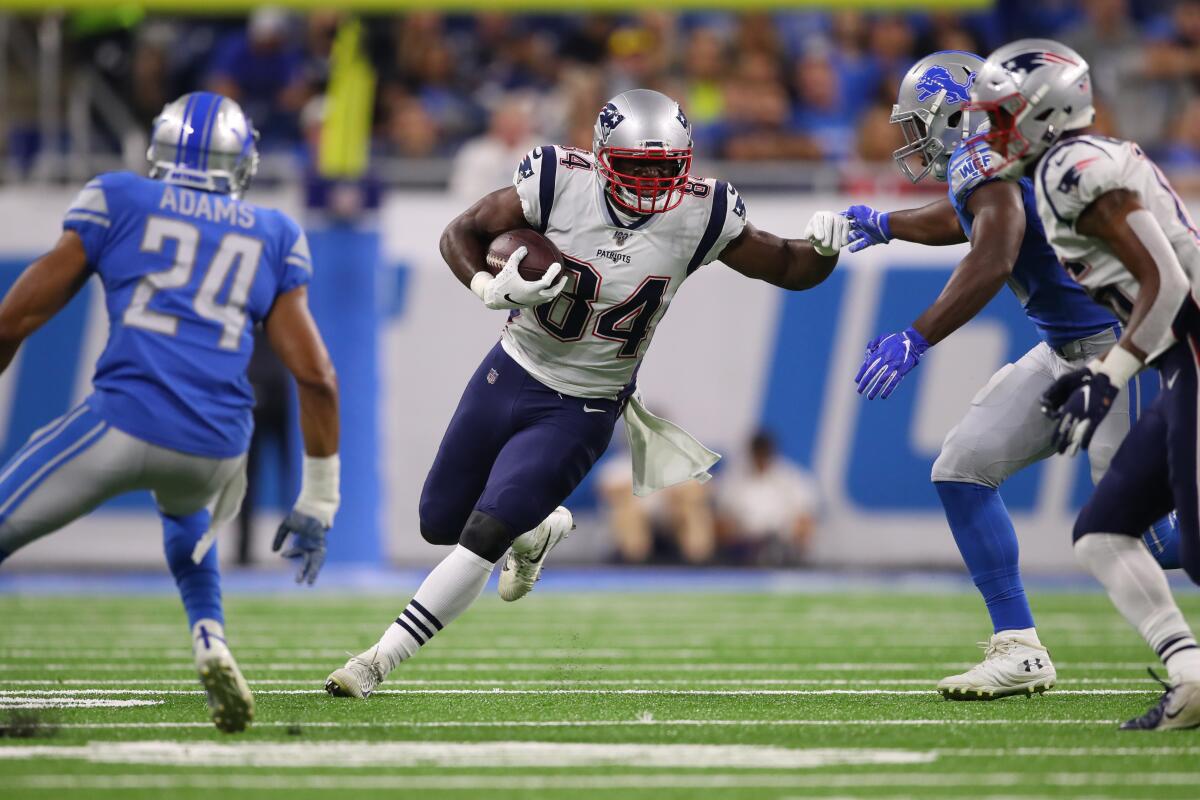 New England Patriots' Benjamin Watson (84) looks for yards after a second quarter catch while playing the Detroit Lions during a preseason game on Thursday in Detroit.