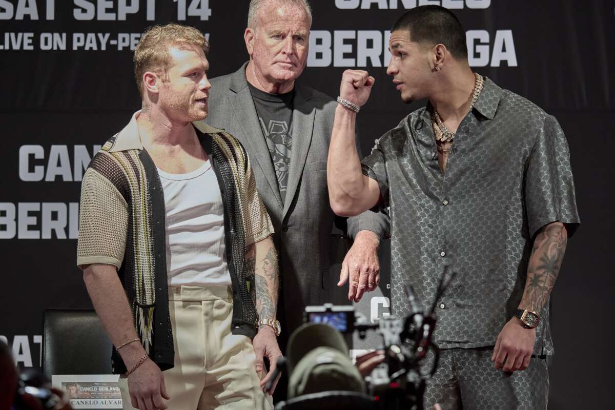 Canelo Álvarez and Edgar Berlanga face off during a news conference in Beverly Hills on Aug. 6.