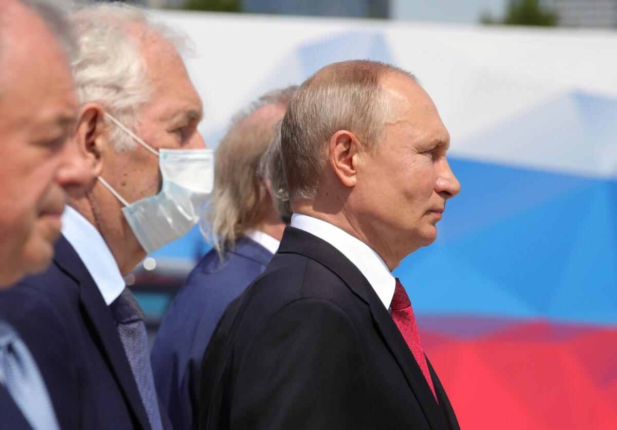 Russian President Vladimir Putin, right, attends a ceremony in Moscow to recognize heroes of labor.
