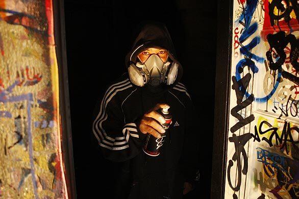 Graffiti artist Daniel Ramos, better known by his tagging name, "Chaka," will have a one-man show titled, "Resurrection," on view at Mid-City Arts. He only agreed to be photographed if he could wear a spray-painter's mask.