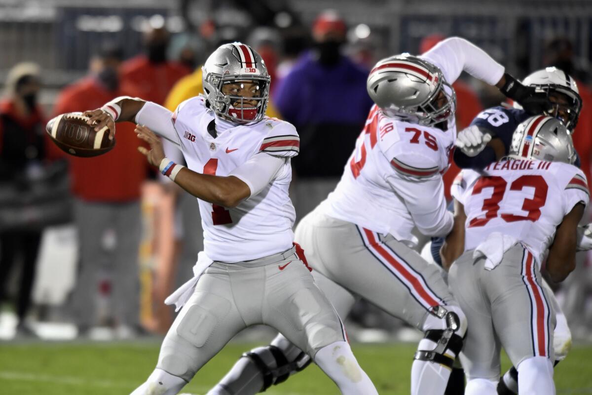 Ohio State quarterback Justin Fields looks for a receiver against Penn State on Oct. 31, 2020. 