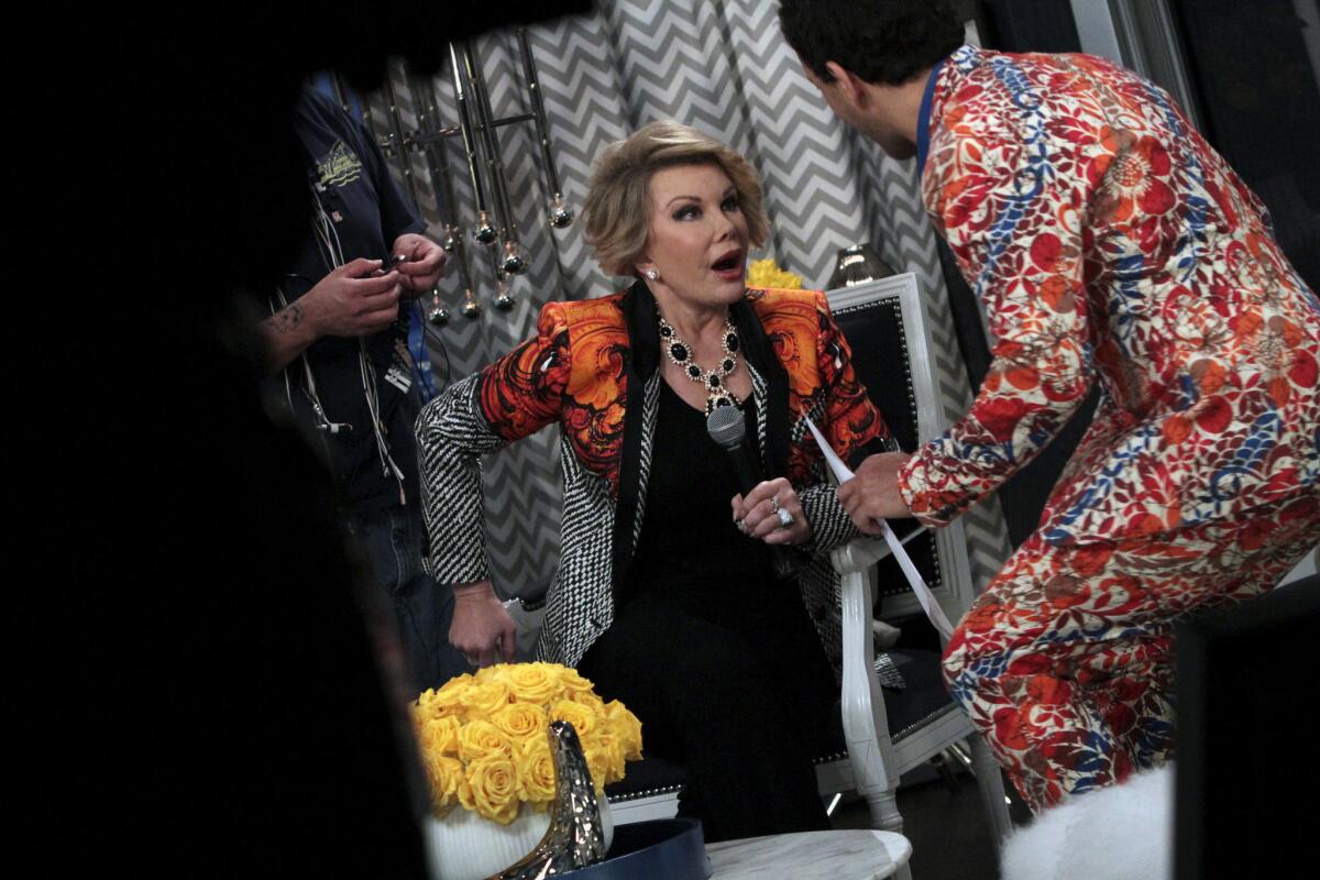 Joan Rivers with with George Kotsiopoulos on the set of "Fashion Police."