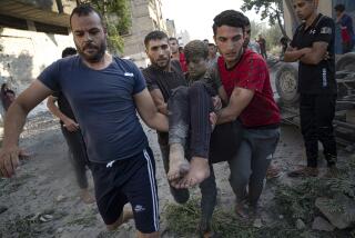 Palestinians carry a person wounded in Israeli airstrikes in Khan Younis, Gaza Strip, Monday, Oct. 16, 2023. (AP Photo/Fatima Shbair)