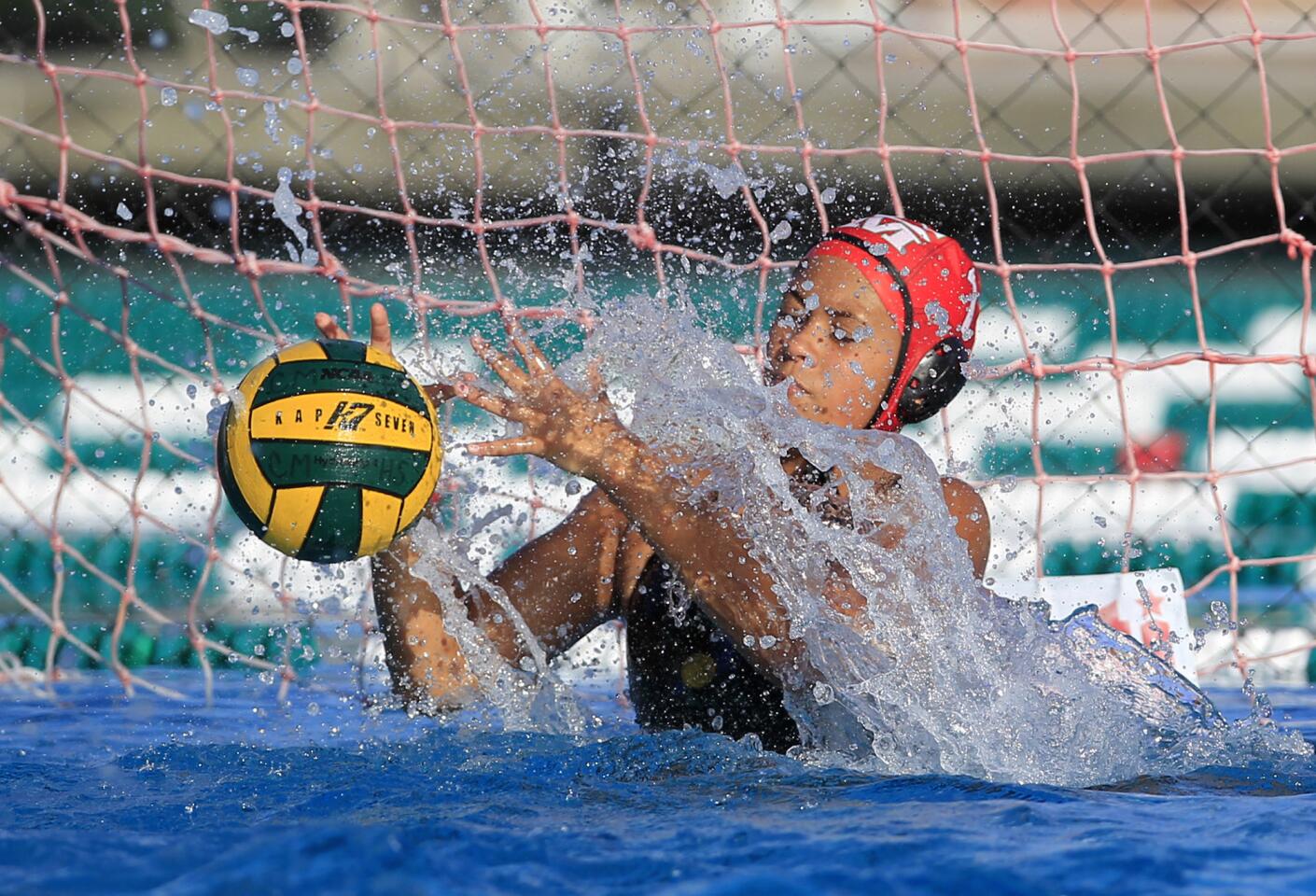 Costa Mesa High goalkeeper Antonia Velasquez makes a save during the first half against Estancia in an Orange Coast League game on Wednesday.