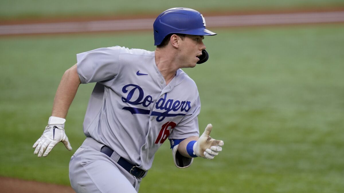 Dodgers catcher Will Smith runs to first against the Atlanta Braves.