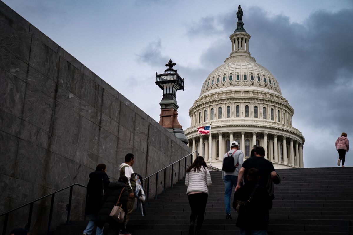 Visitors ascend the steps of United States Capitol in Oct. 2022