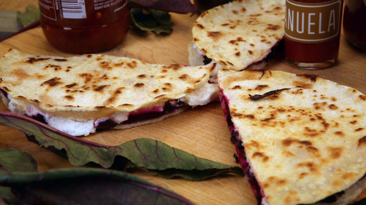 Beet green, roasted beets and goat cheese quesadillas.