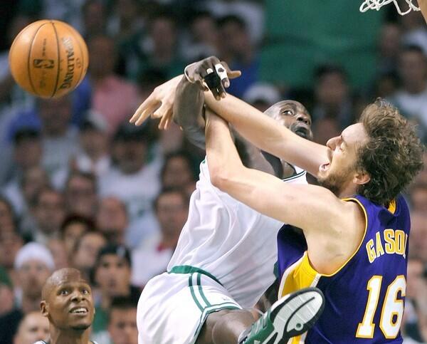 Lakers power forward Pau Gasol is fouled by Boston power forward Kevin Garnett in Game 1 of the 2008 NBA Finals. Garnett would lead the Celtics to a 98-88 victory at TD Banknorth Garden with 23 points and 13 rebounds.