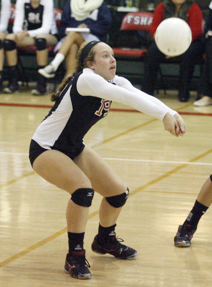 FSHA's Emily Develle hits the ball during a game against Chaminade at Flintridge Sacred Heart Academy in La Canada on Thursday, October 11, 2012.