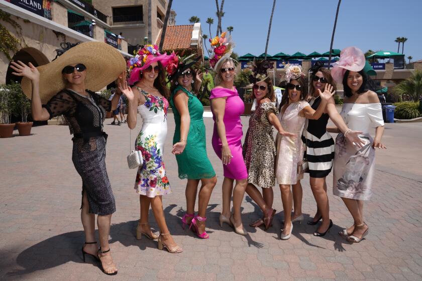 Race fans took part in the annual tradition of wearing fashionable hats.