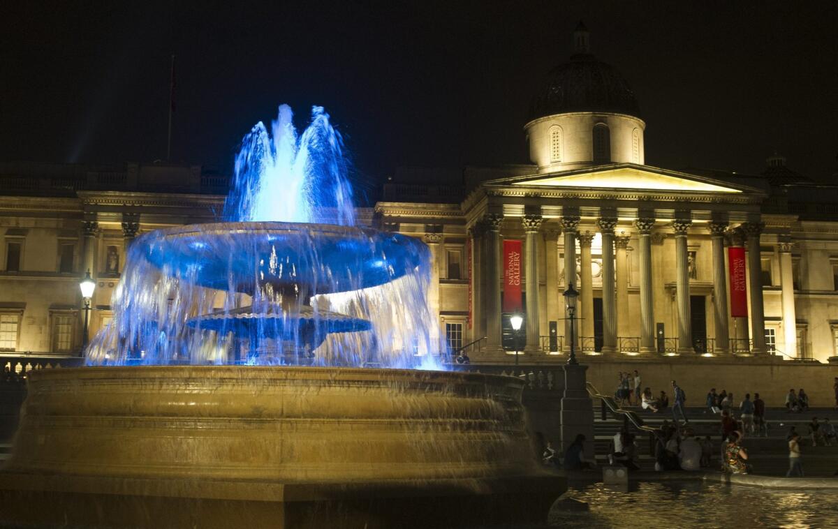 The fountains in Trafalgar Square are illuminated in blue on Monday to mark the birth of a baby boy to the Duke and Duchess of Cambridge.