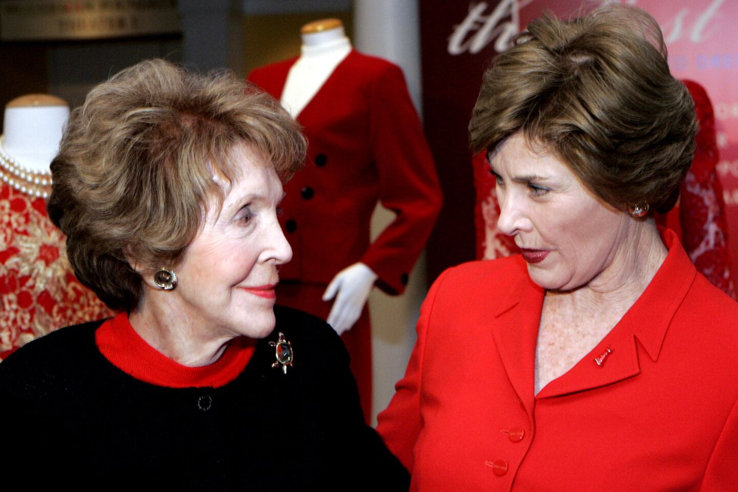 The First Lady's in front of the Red Dress display. First Lady Laura Bush and former First Lady Nancy Reagan participated in the Heart Truth Roundtable at the Reagan Library in Simi Valley on Wednesday, February 28, 2007. Later they visited students at Balboa Magnet School in Northridge who are part of a National Park Service program.