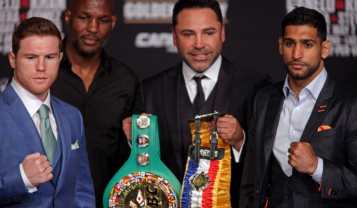 From left, Canelo Alvarez, Bernard Hopkins, Oscar De La Hoya and Amir Khan pose with the WBC Middleweight belt during their final news conference at the MGM Grand in Las Vegas on Wednesday.