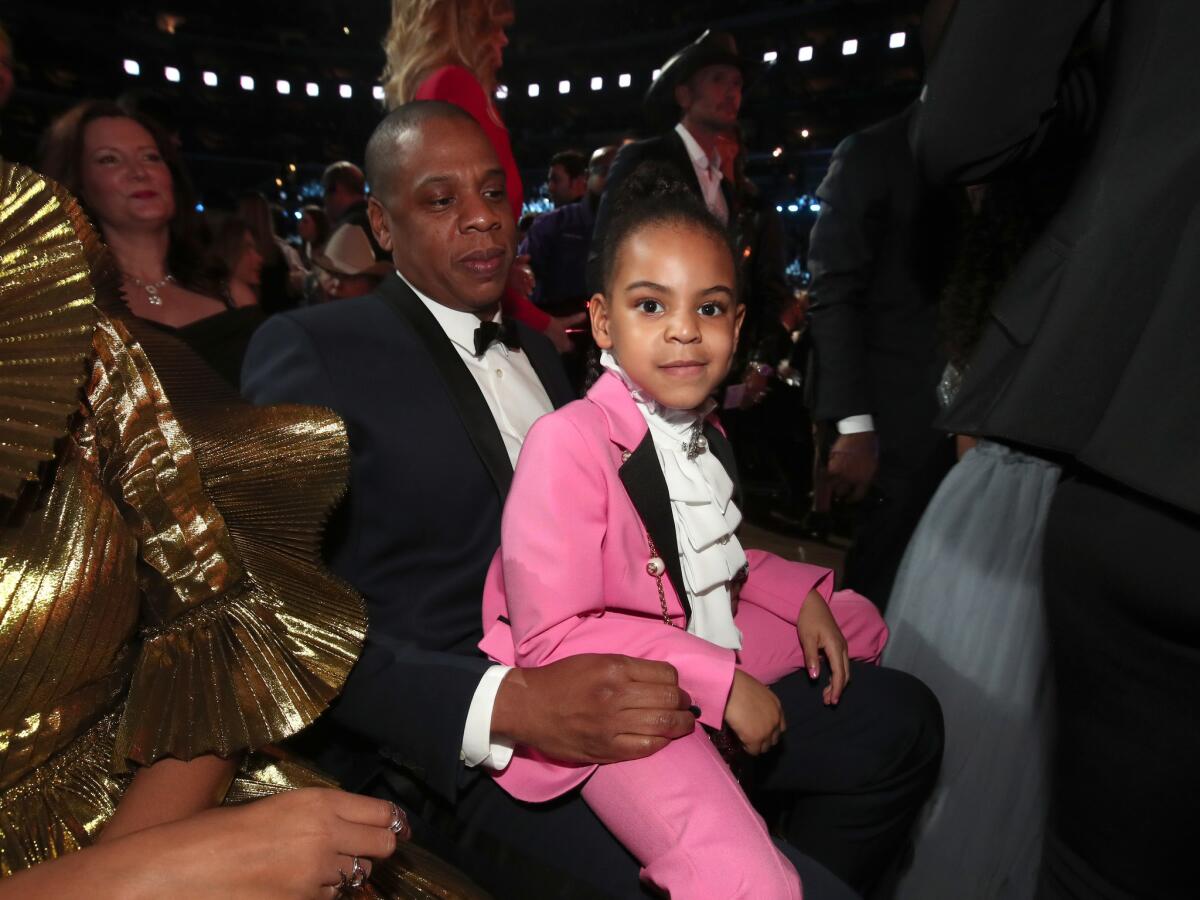 Blue Ivy in dad Jay Z's lap at the Grammys.