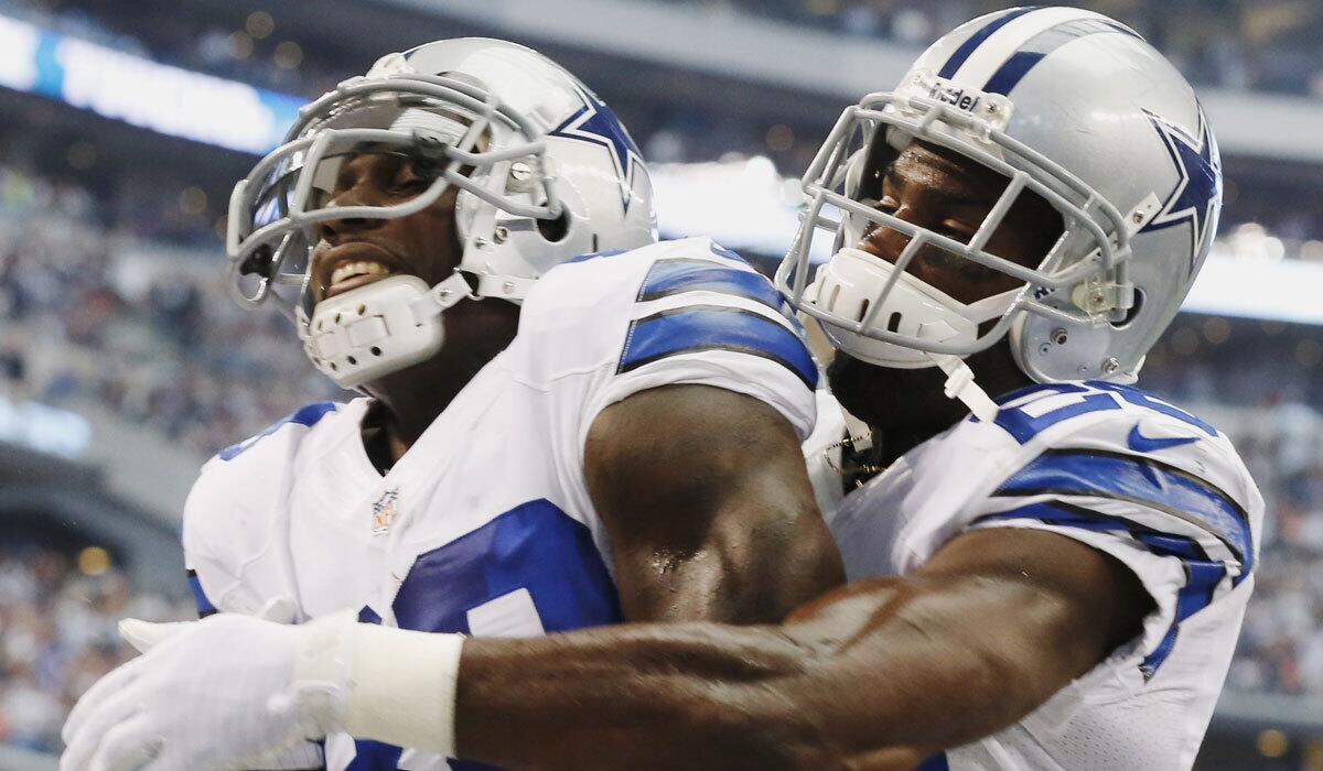 Dallas wide receiver Dez Bryant, left, celebrates his touchdown against Denver with DeMarco Murray in October 2013.