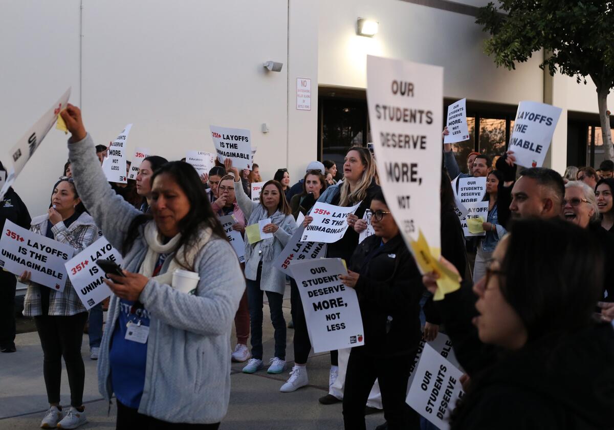 Teachers and counselors gather to protest the Santa Ana Unified School District school board's plans for a mass layoff.