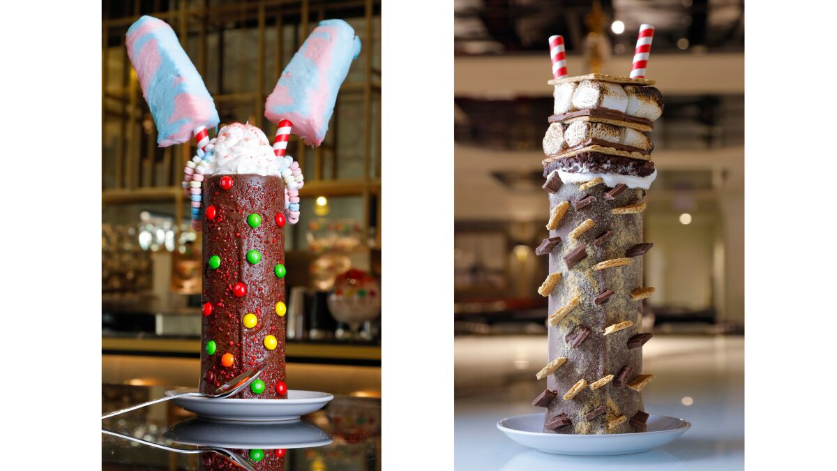 Blinged out: The Insane Milkshakes at Sugar Factory include the Tie Dye (left), a classic vanilla shake with cotton candy, Skittles, Pop Rocks and candy necklaces. The chocolate-coffee Campfire S'Mores has an eight-layer s'more with a brownie base.
