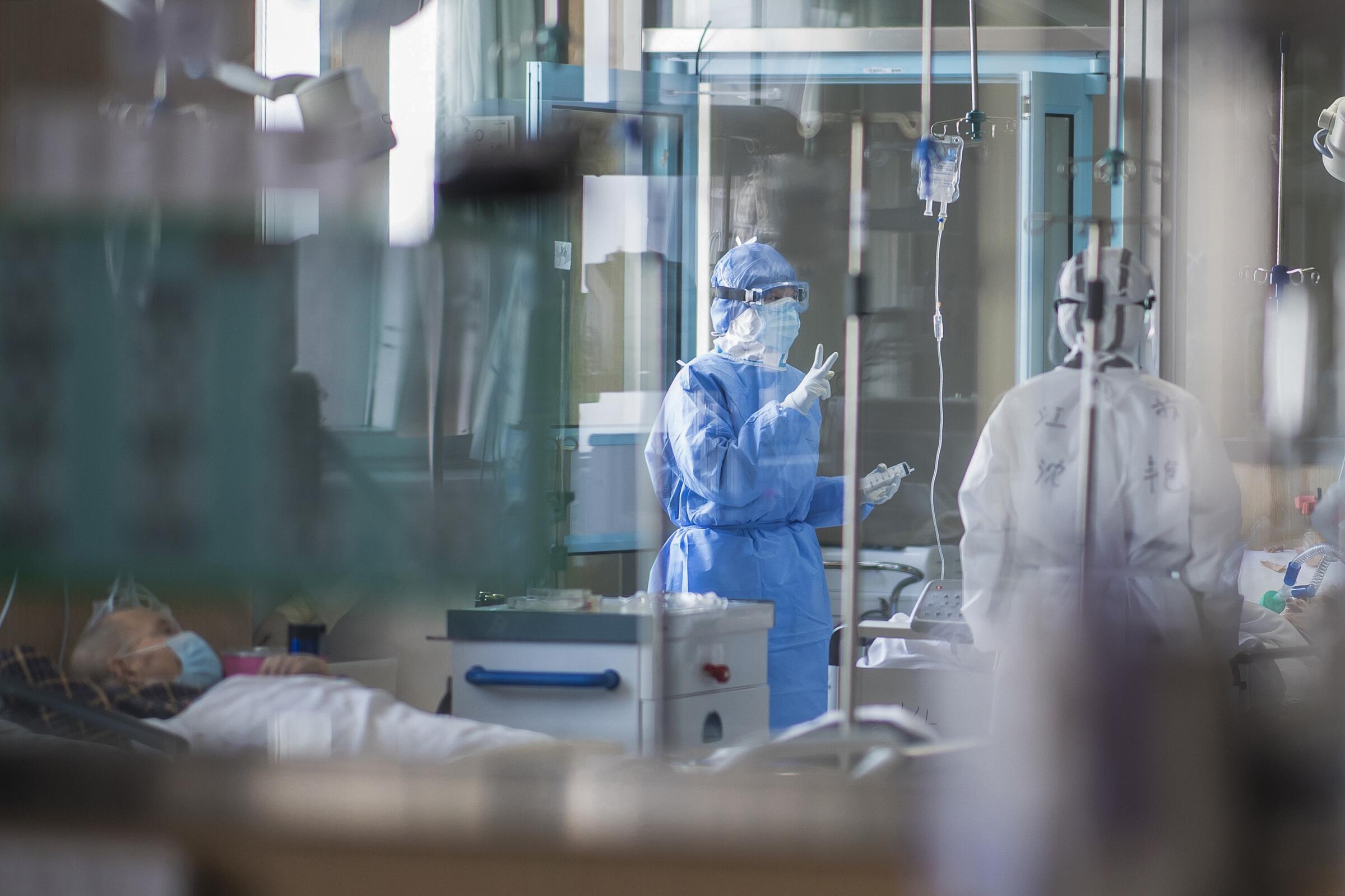 Nurses work at an ICU ward for COVID-19 patients in Wuhan during the early weeks of the pandemic.