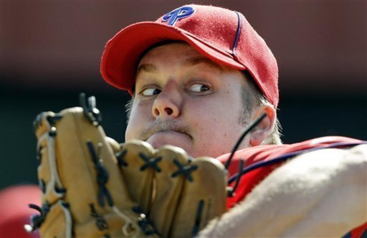 From left, Philadelphia Phillies pitchers Roy Oswalt, Joe Blanton