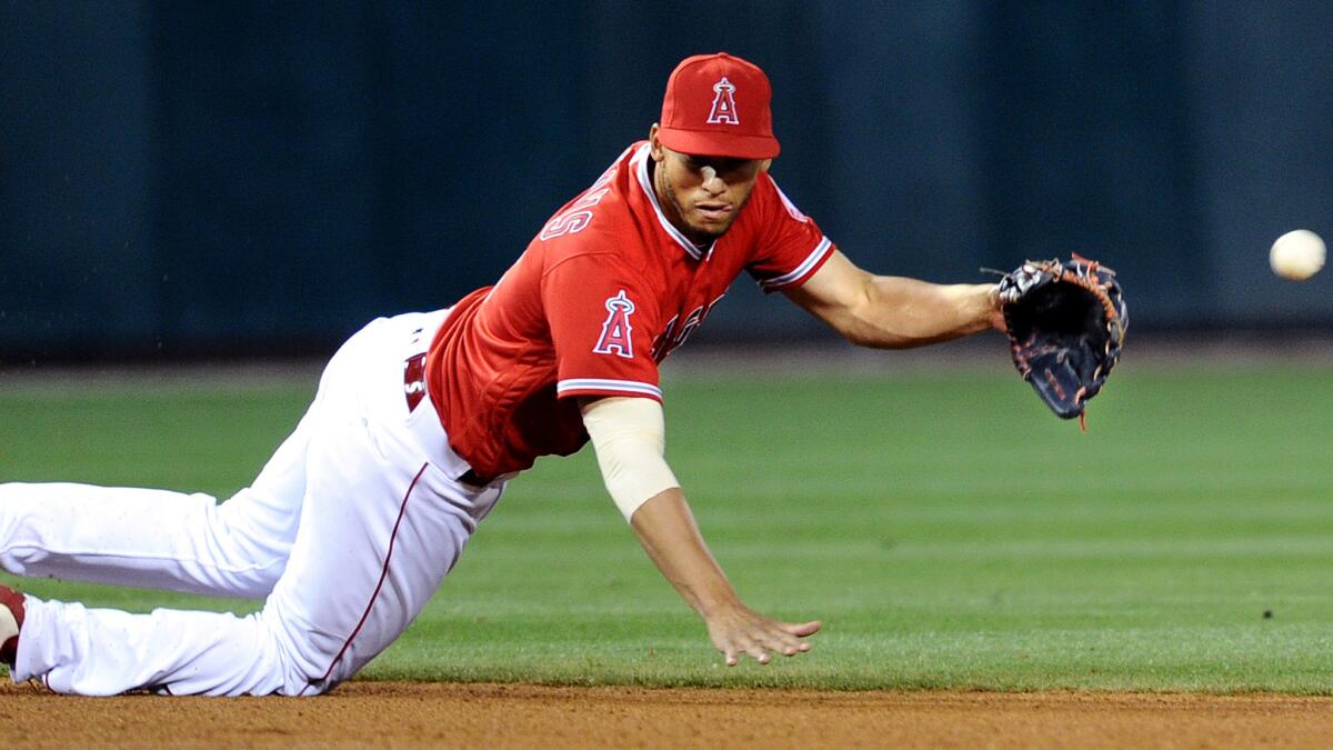 Angels shortstop Andrelton Simmons dives for a ball hit by the Cubs' Jorge Soler during a game April 4.