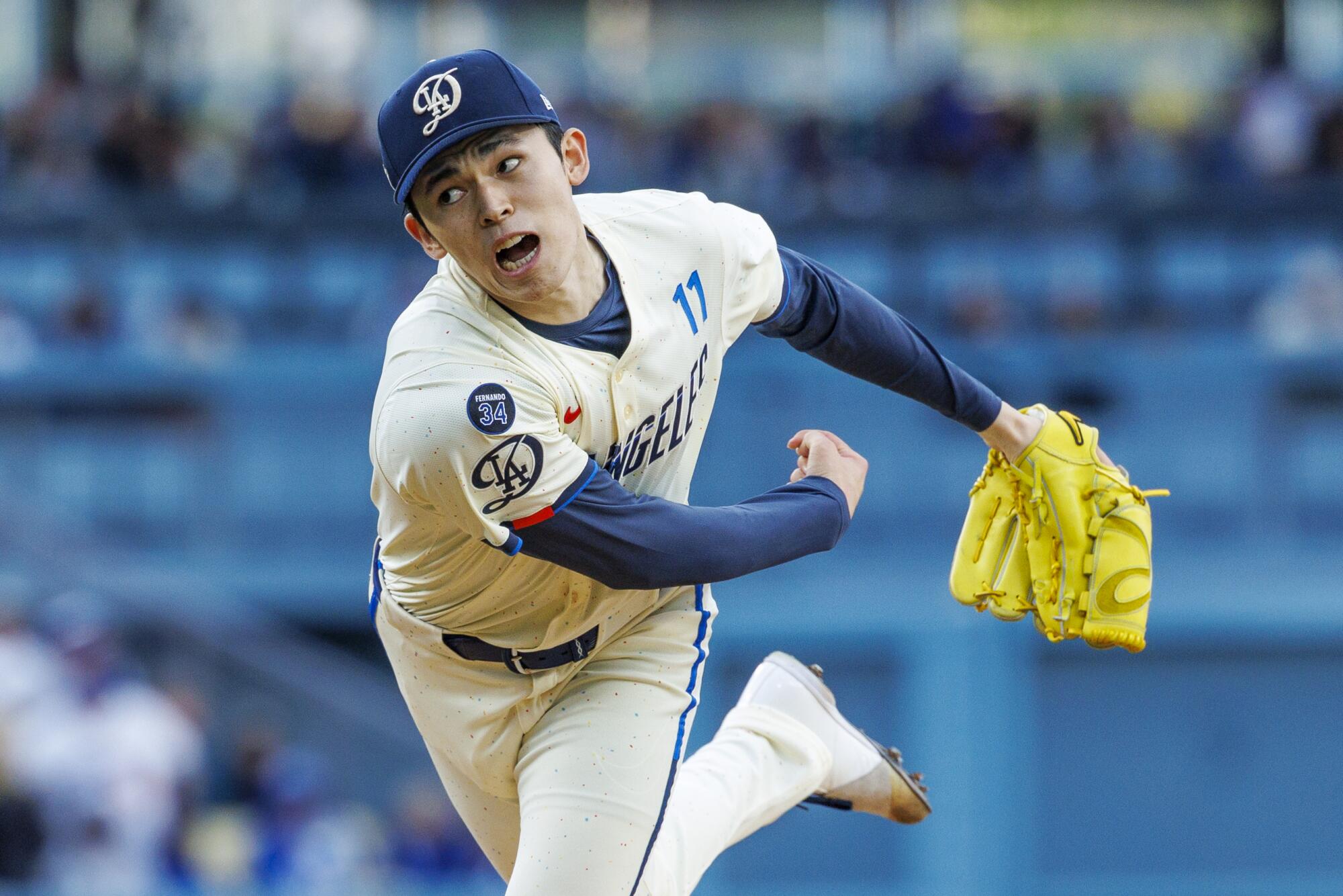 Dodgers pitcher Roki Sasaki delivers against the Pirates on Saturday.