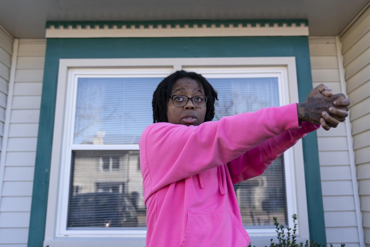 A woman demonstrating how a gunman shot indiscriminately.