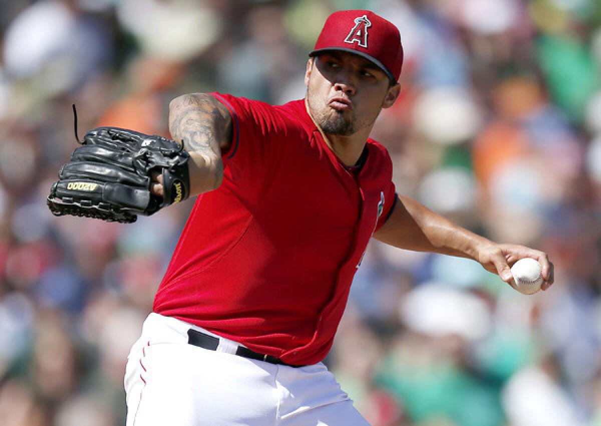 Angels starting pitcher Hector Santiago went 5 1/3 innings agianst the Giants in an exhibition game Monday at Diablo Stadium in Tempe, Ariz.