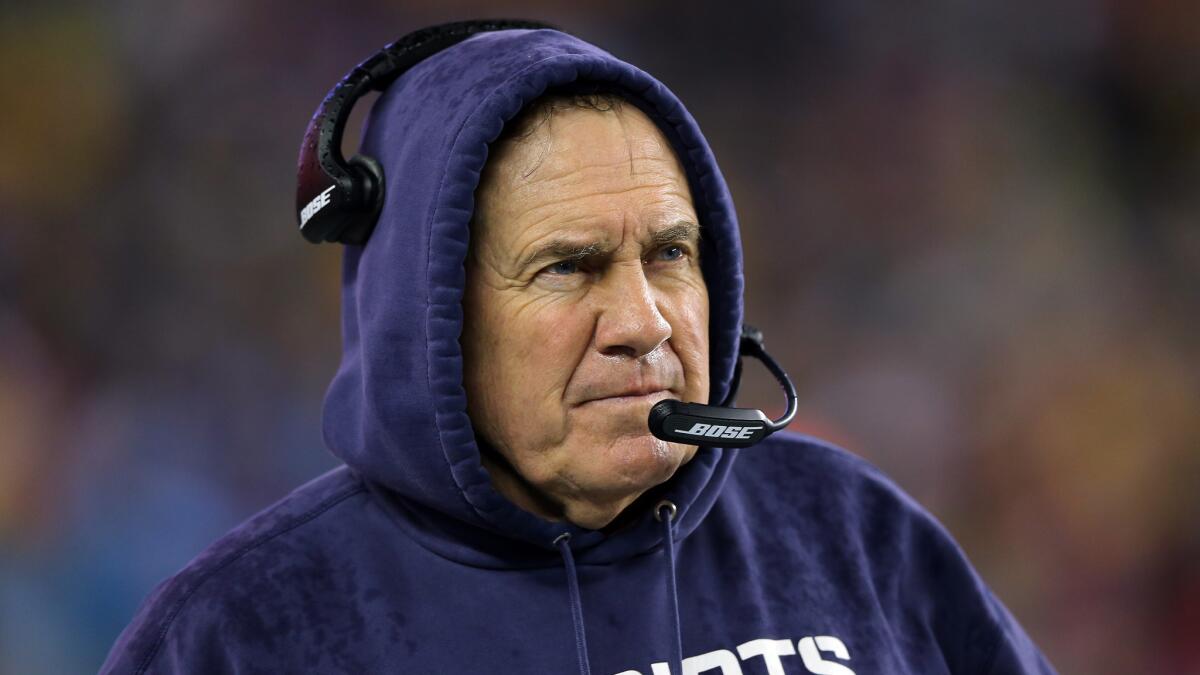 Coach Bill Belichick watches from the sideline during the New England Patriots' blowout win over the Indianapolis Colts in the AFC championship game on Sunday.