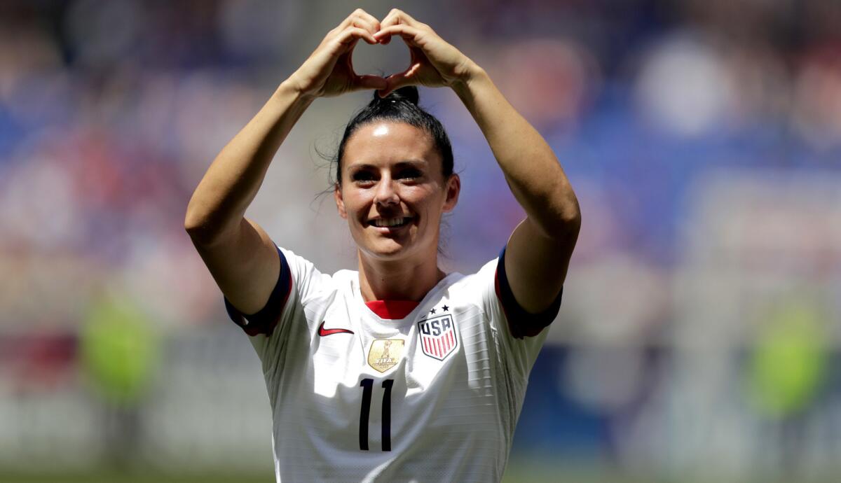 U.S. defender Ali Krieger acknowledges fans during a World Cup send-off ceremony in Harrison, N.J., on May 26.