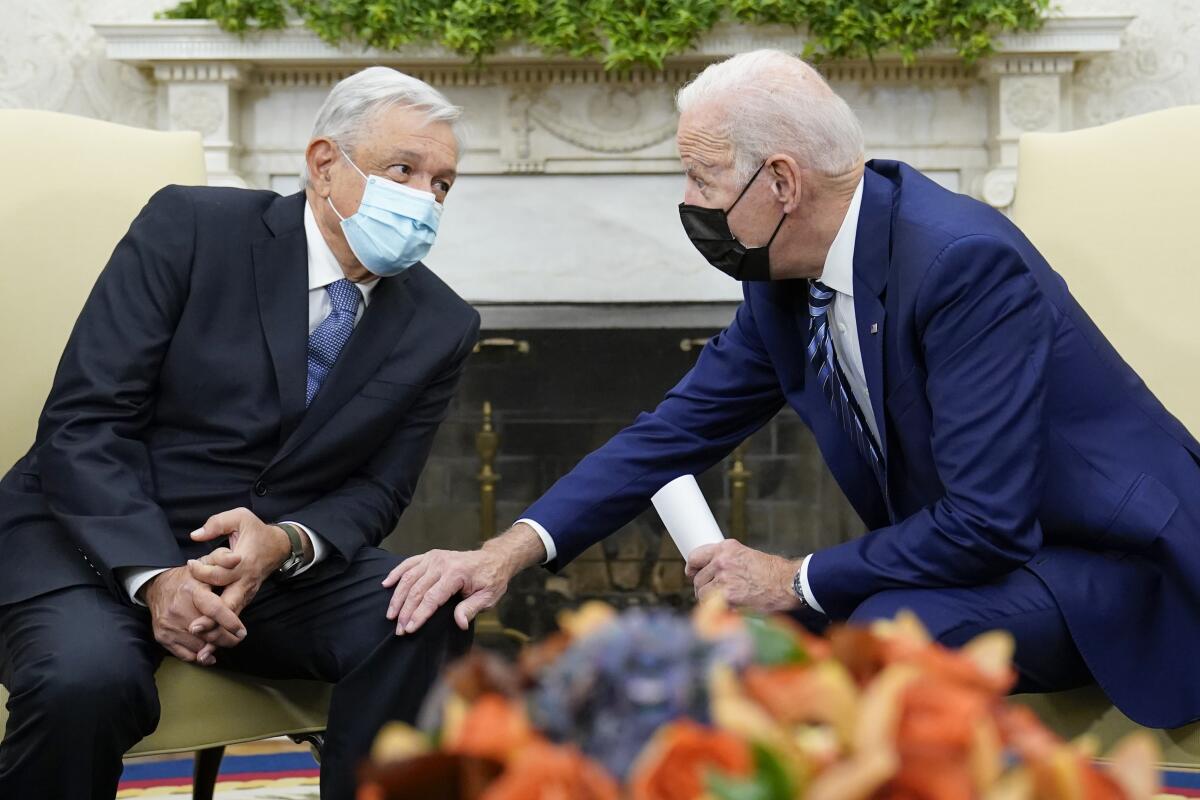 FILE - President Joe Biden meets with Mexican President Andrés Manuel López Obrador in the Oval Office 