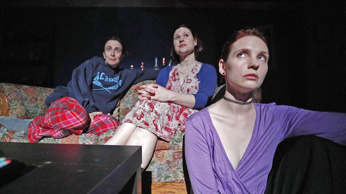 Sisters Austin, Dallas and Baltimore, played by Jessica Blair, Leslie Connelly and Sheena Leigh, watch TV during rehearsal of a scene for the play "Sister Cities" at Sidewalk Studio Theatre in Burbank.