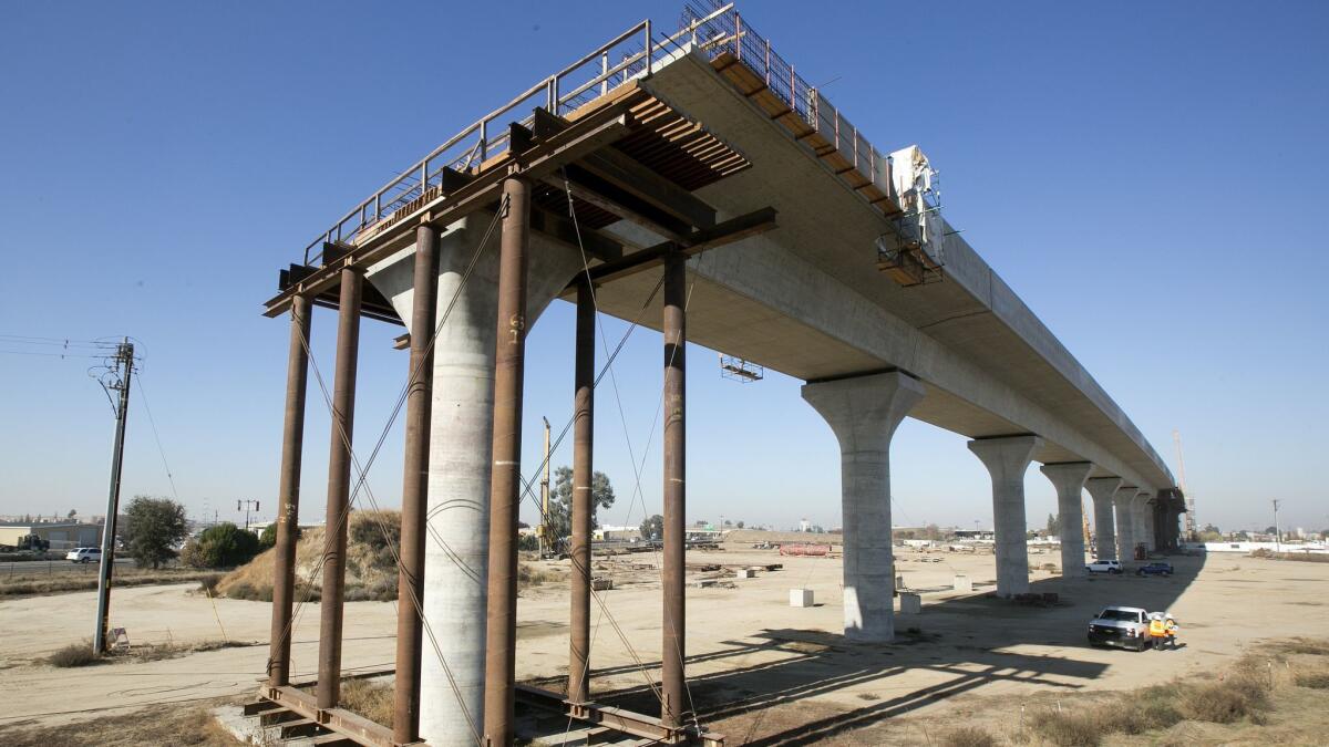 An elevated section of the high-speed rail line is under construction in Fresno. The California rail authority said Monday that a Trump administration move to rescind $3.5 billion in grants for the rail is “rash and unlawful.”