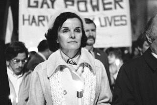 FILE - San Francisco Mayor Dianne Feinstein carries a candle as she leads an estimated 15,000 marchers also carrying candles during a march in memory of slain Mayor George Moscone and Supervisor Harvey Milk in San Francisco, Nov. 28, 1979. In the background is a sign that says "Gay Love is Gay Power." Democratic Sen. Dianne Feinstein of California has died. Three people familiar with the situation confirmed her death to The Associated Press on Friday, Sept. 29, 2023. She was 90. (AP Photo/Paul Sakuma, File)