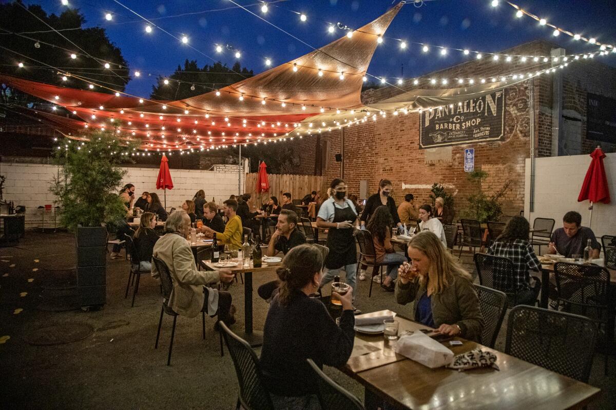 Diners on the outdoor patio at Hippo Restaurant.