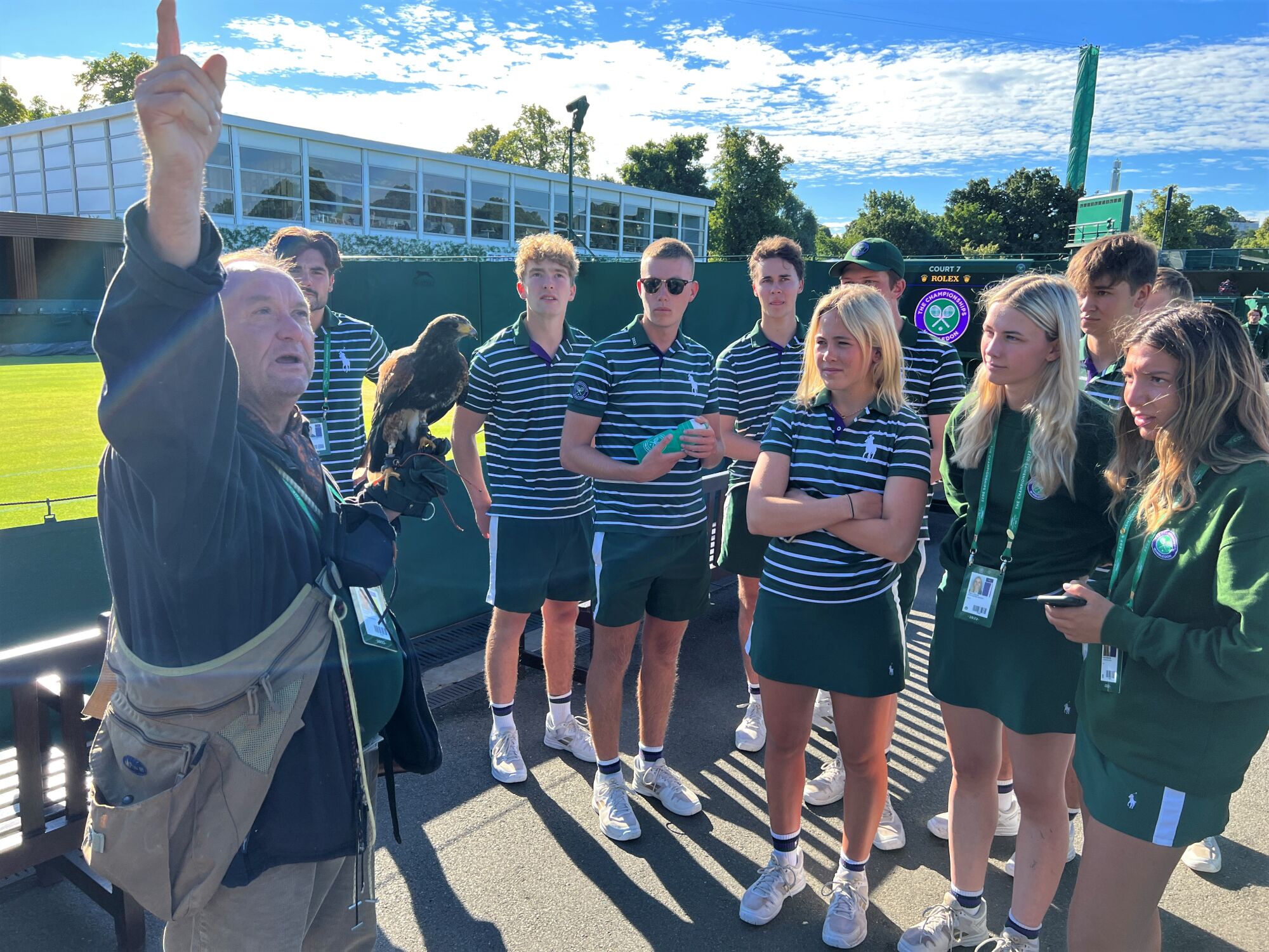 Wayne Davis introduces Rufus to Wimbledon ball boys and girls in the morning before spectators arrive and play begins.