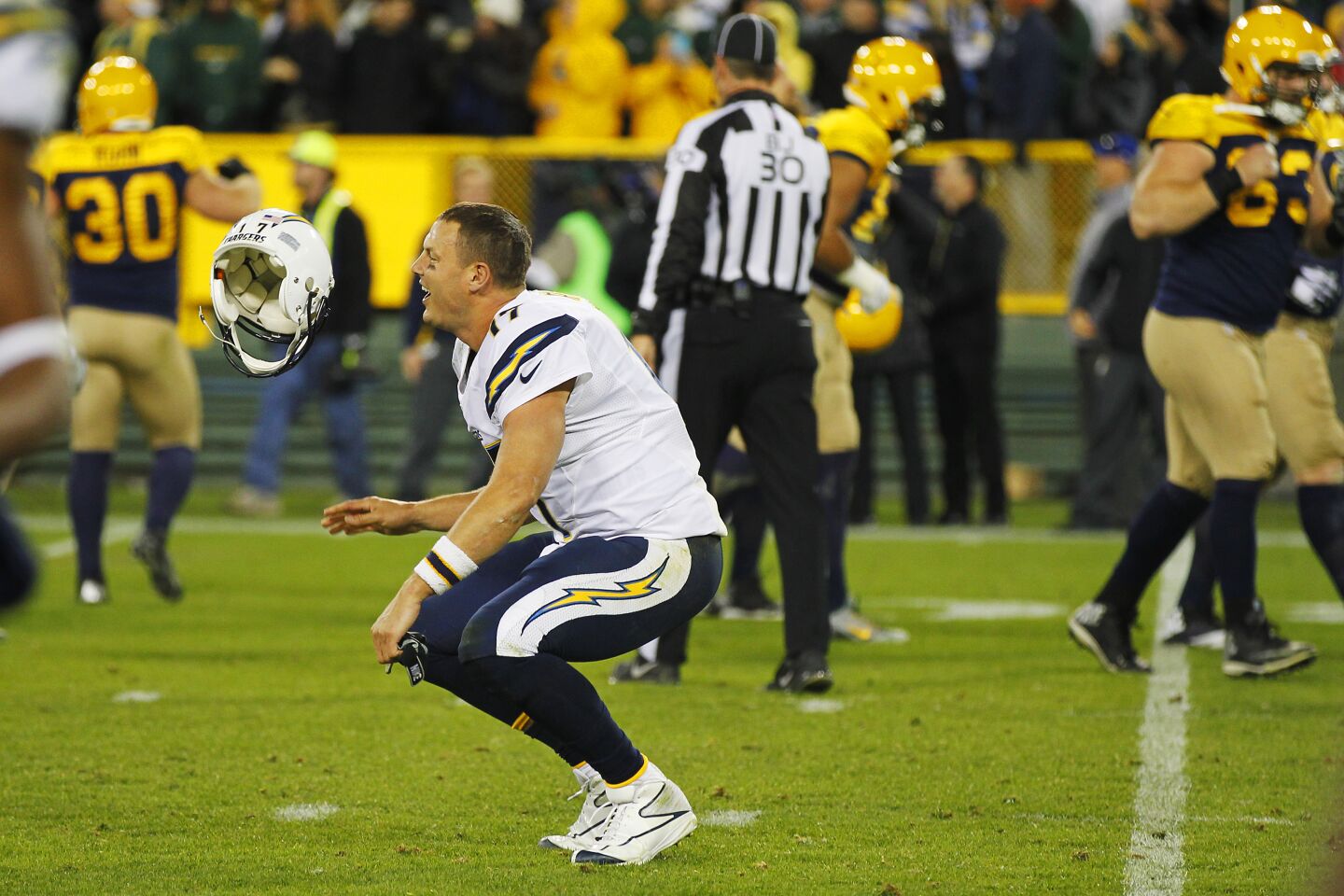 Chargers Philip Rivers flips his helmet at the end of a 27-20 loss to the Packers in Green Bay on Oct. 18, 2015.