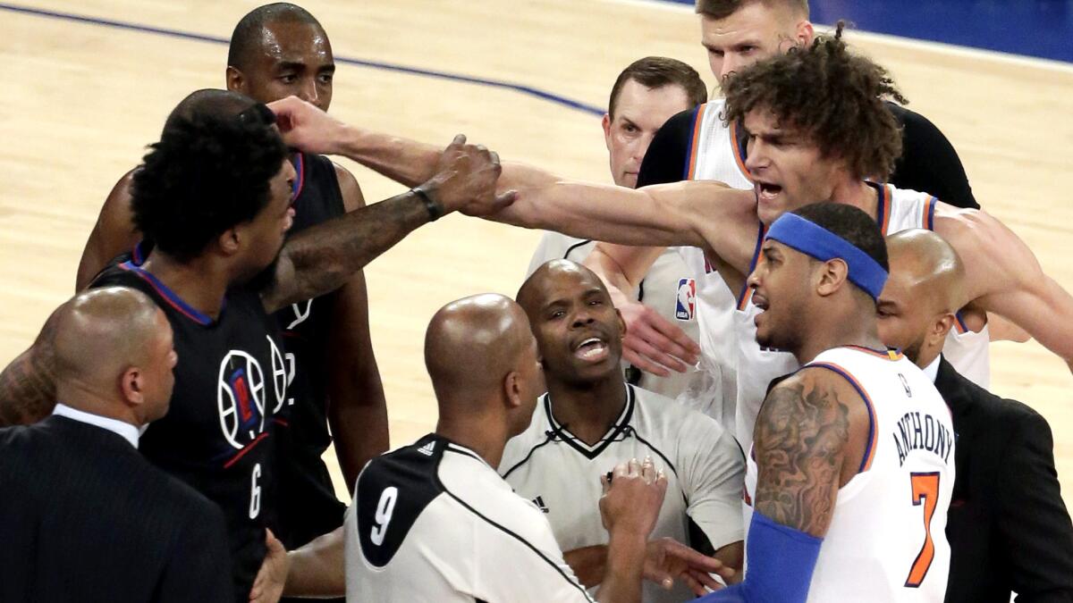 Knicks center Robin Lopez lunges at Clippers center DeAndre Jordan after a scuffle ensued following a flagrant foul that was called on Lopez, who was ejected from the game Friday night.