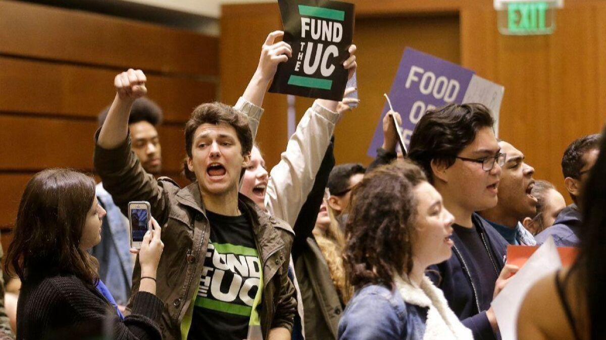 Students protest tuition hikes at a 2016 University of California Board of Regents meeting in San Francisco.
