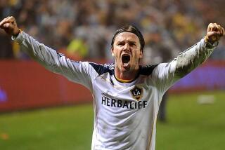Galaxy midfielder David Beckham celebrates as time expires.This is the Galaxy's third MLS championship and the first since 2005. It's also Beckham's first title in L.A.