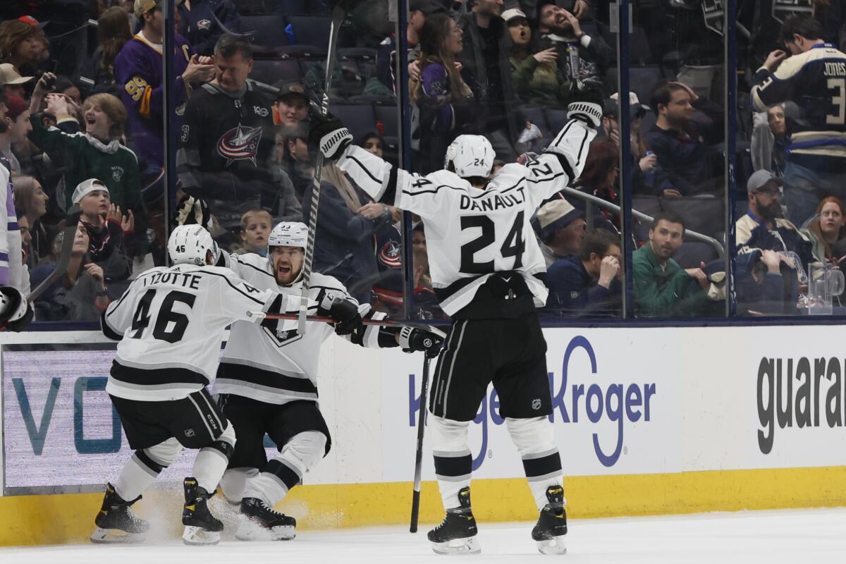 Kings forward Viktor Arvidsson, center, celebrates with teammates Blake Lizotte and Phillip Danault in overtime.