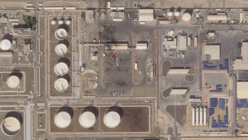 This satellite image provided Planet Labs PBC shows the aftermath of an attack claimed by Yemen's Houthi rebels on an Abu Dhabi National Oil Co. fuel depot in the Mussafah neighborhood of Abu Dhabi, United Arab Emirates, Saturday, Jan. 22, 2022. The United Arab Emirates intercepted two ballistic missiles targeting Abu Dhabi in a new attack early Monday, Jan. 24, 2022, its state-run news agency reported, the latest attack to target the Emirati capital. No group immediately claimed responsibility but suspicion immediately fell on the Houthis. (Planet Labs PBC via AP)