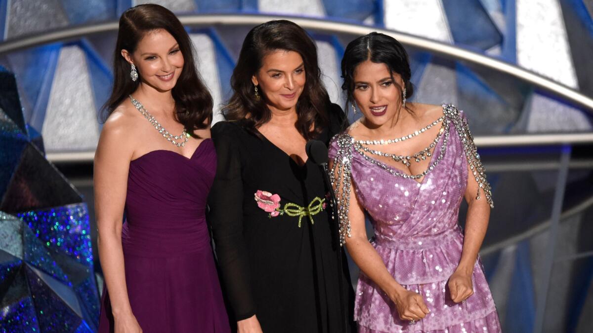 Ashley Judd, Annabella Sciorra and Salma Hayek speak at the Oscars.