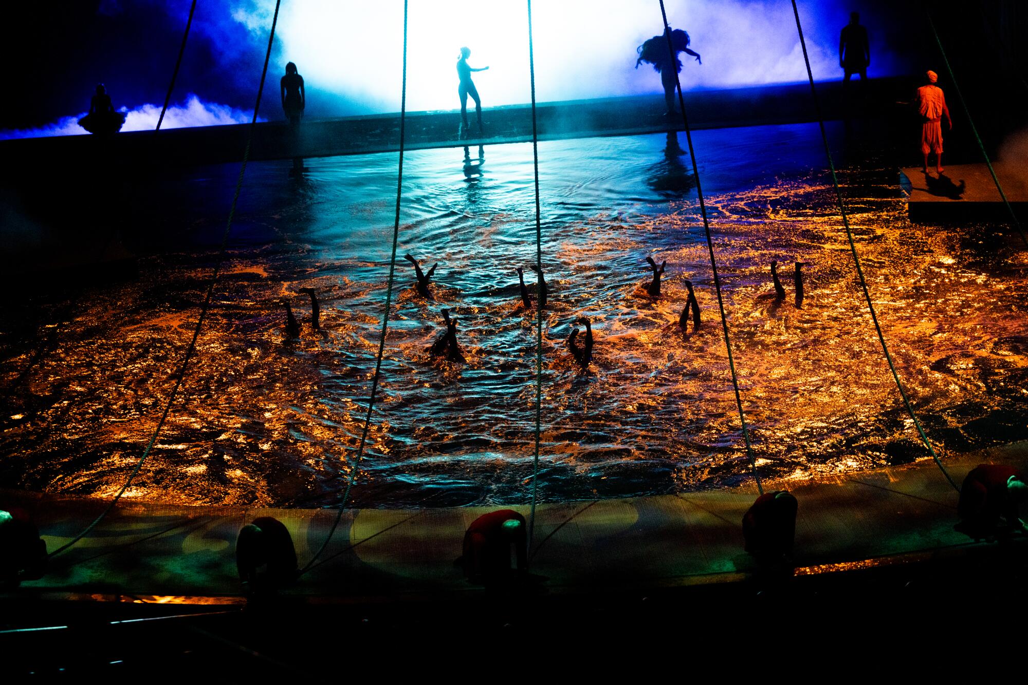 Synchronized swimmers perform in the water during Cirque du Soleil's "O."